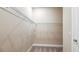 An empty walk-in closet with wire shelving and neutral carpeting for storage at 4197 Barbuda Ln, Kissimmee, FL 34758