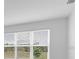 Bright bedroom with a large window offering a view of the outdoors at 4203 Barbuda Ln, Kissimmee, FL 34758