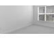 Bedroom with neutral carpet and a large window providing natural light at 4203 Barbuda Ln, Kissimmee, FL 34758