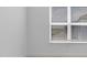 Bright bedroom featuring a window with blinds and neutral paint color at 4203 Barbuda Ln, Kissimmee, FL 34758