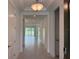 Bright entryway with neutral walls and tile flooring, leading to an open living space at 4203 Barbuda Ln, Kissimmee, FL 34758
