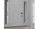 Elegant white front door with sidelights and modern hardware, welcoming you home at 4203 Barbuda Ln, Kissimmee, FL 34758