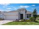 Charming single-Gathering home with a well-manicured lawn and a two-car garage at 4203 Barbuda Ln, Kissimmee, FL 34758