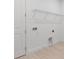 Clean, well-lit laundry area with a door and a wire rack shelving system at 4203 Barbuda Ln, Kissimmee, FL 34758