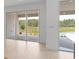 Bright living area featuring lots of windows to the exterior and light wood-look flooring at 4203 Barbuda Ln, Kissimmee, FL 34758