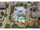 Aerial view highlighting the community's lake, pool, clubhouse, parking, and surrounding residential area at 5144 City St # 238, Orlando, FL 32839