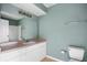 Bathroom features a vanity with a large mirror, standard toilet, and shower with tub at 5144 City St # 238, Orlando, FL 32839