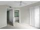Bedroom with double closets leading to an ensuite bathroom featuring a sink vanity at 5144 City St # 238, Orlando, FL 32839