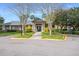 Inviting clubhouse entrance with well-maintained landscaping and ample parking at 5144 City St # 238, Orlando, FL 32839