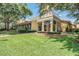 Attractive restaurant with covered porch, manicured lawn, and mature trees at 5144 City St # 238, Orlando, FL 32839