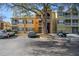 A full exterior view of the condos showcasing parking and outdoor living spaces at 5144 City St # 238, Orlando, FL 32839