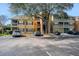 Exterior view of condo buildings showing parking and balconies, under a clear sky at 5144 City St # 238, Orlando, FL 32839