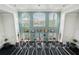 Bright fitness center featuring modern treadmills and large windows with scenic views at 5144 City St # 238, Orlando, FL 32839