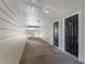 Hallway featuring a view of the staircase, doors with unit numbers, and overhead lighting at 5144 City St # 238, Orlando, FL 32839