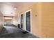 Hallway with multiple unit entrances and covered access to each condo at 5144 City St # 238, Orlando, FL 32839