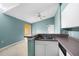 Open kitchen features a breakfast bar, double basin sink, and access to the screened porch at 5144 City St # 238, Orlando, FL 32839