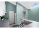 Kitchen featuring white appliances, white cabinetry, and a breakfast bar at 5144 City St # 238, Orlando, FL 32839