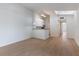 Bright living room featuring wood floors, a skylight, and an open floor plan at 5144 City St # 238, Orlando, FL 32839