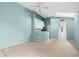 Spacious living room featuring a ceiling fan, skylight and an open kitchen area at 5144 City St # 238, Orlando, FL 32839