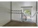 Concrete staircase with black railings and white accents, providing access to the upper units at 5144 City St # 238, Orlando, FL 32839