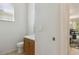Half bathroom with a clean design, featuring a classic vanity, toilet, and is conveniently located near the living areas at 612 Old Pine Ct, Sanford, FL 32773