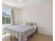 A cozy bedroom with a large window providing natural light and calm ambiance at 612 Old Pine Ct, Sanford, FL 32773