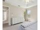 Bedroom featuring a neutral color palette, window, ceiling fan and large dresser at 612 Old Pine Ct, Sanford, FL 32773