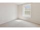 Bright bedroom with natural light from a window, carpet, and neutral walls, offering a clean and versatile space at 612 Old Pine Ct, Sanford, FL 32773