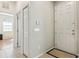 Welcoming entryway with tile flooring and a view to another room, providing a glimpse of the home's interior at 612 Old Pine Ct, Sanford, FL 32773