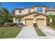 Charming two-story townhome features attached garage and landscaped front yard at 612 Old Pine Ct, Sanford, FL 32773
