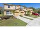Charming townhomes with well-maintained lawns, driveways, and manicured landscaping, creating curb appeal at 612 Old Pine Ct, Sanford, FL 32773