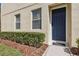 Inviting front entrance with a stylish blue door, tidy landscaping, and a welcoming walkway at 612 Old Pine Ct, Sanford, FL 32773