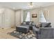 Bright living room featuring stylish furniture, a rug, and a dining area at 612 Old Pine Ct, Sanford, FL 32773