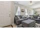 Cozy living room with plenty of natural light and comfortable seating at 612 Old Pine Ct, Sanford, FL 32773