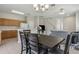 Open-concept living space combining the kitchen, dining area, and living room, creating a seamless flow for modern living at 612 Old Pine Ct, Sanford, FL 32773
