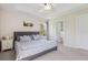The main bedroom features natural light, a ceiling fan and en-suite bathroom at 612 Old Pine Ct, Sanford, FL 32773