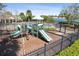 View of the community playground in proximity to the pool and lake at 612 Old Pine Ct, Sanford, FL 32773