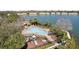Aerial view of the community pool, clubhouse, playground, and lakeside location at 612 Old Pine Ct, Sanford, FL 32773
