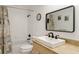 Bathroom featuring a shower/tub combination, decorative mirror and countertop at 6133 Seagull Ln, Lakeland, FL 33809