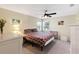 Cozy bedroom with a ceiling fan, carpet, and bright windows at 6133 Seagull Ln, Lakeland, FL 33809