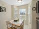Cozy breakfast nook filled with natural light, featuring a tile-top table and views of the front yard at 6133 Seagull Ln, Lakeland, FL 33809