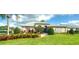 Inviting clubhouse with well-maintained landscaping, trimmed bushes, and a welcoming entrance at 6133 Seagull Ln, Lakeland, FL 33809