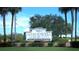 Sandpiper Golf & Country Club signage welcomes you with lush landscaping and inviting atmosphere at 6133 Seagull Ln, Lakeland, FL 33809