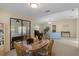 Bright dining area with a large glass sliding door leading to the backyard and comfortable seating at 6133 Seagull Ln, Lakeland, FL 33809