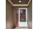 Welcoming entryway featuring a sturdy front door and a sidelight, complemented by exterior trim at 6133 Seagull Ln, Lakeland, FL 33809