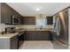 Kitchen featuring stainless steel appliances, granite countertops and modern cabinetry at 6133 Seagull Ln, Lakeland, FL 33809