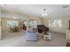 Open-concept living area with dining space, comfortable seating, and lots of natural light at 6133 Seagull Ln, Lakeland, FL 33809