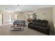Open-concept living area with a spacious layout, comfortable seating, and easy access to other rooms at 6133 Seagull Ln, Lakeland, FL 33809