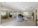 Spacious living room featuring neutral tones, plush carpet, and ample natural light at 6133 Seagull Ln, Lakeland, FL 33809