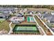 Aerial view of community amenities including a pool, tennis court, and clubhouse at 7699 Sw 74Th Loop, Ocala, FL 34481